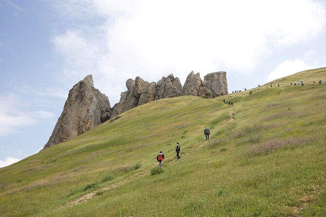 Beshbarmag mountain with sea view and Candy Mountains <em> Day Tour – Key points to know before booking’ /></p>
<ul>
<li><strong>Masazir Lake can look pinkest in the morning:</strong> The early 9:00 am start works in your favor, though the color depends on conditions.</li>
<li><strong>Candy Cane Mountain needs sunshine:</strong> Its beige, pink, and white bands show best in bright weather.</li>
<li><strong>Besh Barmag is more than a viewpoint:</strong> This 5-Finger Mountain has been a stopping place for nearly 3,000 years and remains important for local prayer.</li>
<li><strong>The tour combines countryside and Baku architecture:</strong> You move from saltwater scenery and striped hills to two striking religious and cultural buildings.</li>
<li><strong>The group stays fairly small:</strong> A maximum of 12 people is useful for questions, guide commentary, and getting in and out of the vehicle.</li>
<li><strong>The $60 price covers the main practical needs:</strong> Transport, a professional guide, tea, and selected hotel pickup are included, but entry to the Heydar Aliyev Centre is extra.</li>
</ul>
<h2 id="what-the-60-price-really-buys-you">What the $60 price really buys you</h2>
<p><img width="669" height="446" decoding="async" src=