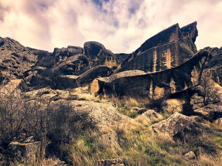 Gobustan, Mud Volcanoes, Fire Temple and Fire Mountain Tour - Reading the oldest marks at Gobustan